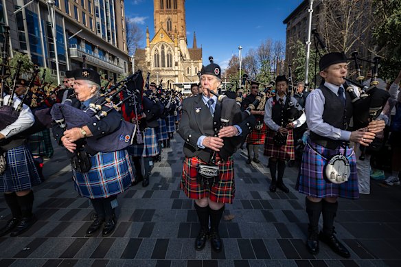 Ladies first: Helen Dilks and other pipers in the City Square.