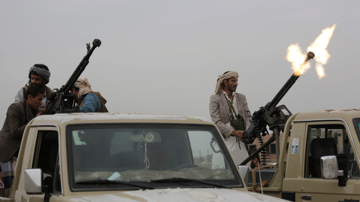 A Houthi rebel fighter fires in the air during a gathering aimed at mobilizing more fighters for the their movement, in Sanaa, Yemen, Thursday, Aug. 1, 2019. The conflict in Yemen began with the 2014 takeover of Sanaa by the Houthis, who drove out the internationally-recognized government. Months later, in March 2015, a Saudi-led coalition launched its air campaign to prevent the rebels from overrunning the country's south. (AP Photo/Hani Mohammed)