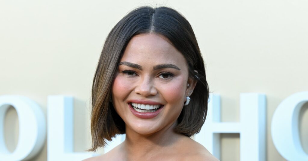 Obsessed With Chrissy Teigen’s Expensive-Looking Floral Blouse? We Found the $15 Version