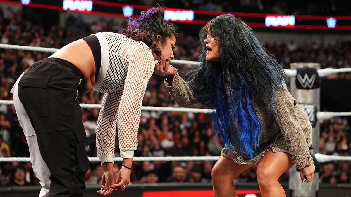 Lyra Valkyria wrestles Bayley in the ring at American Airlines Center.