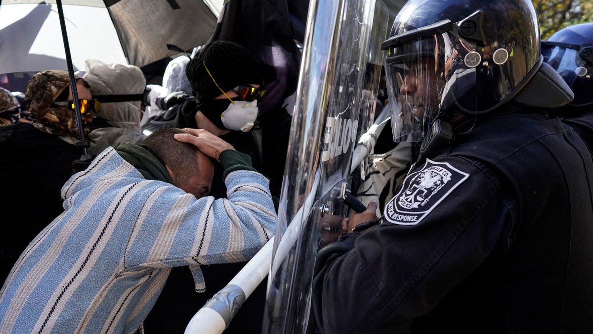 Police, demonstrators clash at