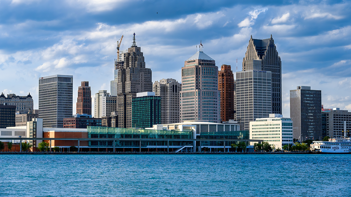 Detroit skyline seen from water with buildings and sky