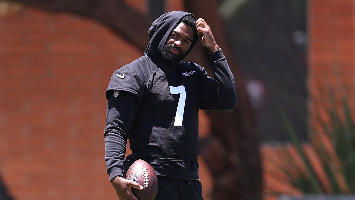 Jacoby Brissett #7 looks on during Arizona Cardinals mandatory minicamp.