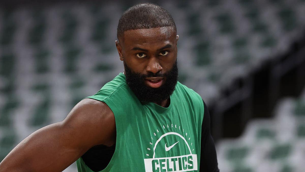 Boston Celtics guard Jaylen Brown standing on the basketball court at TD Garden.