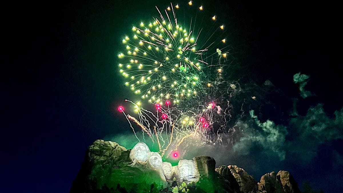 fireworks explode over Mount Rushmore's four presidents