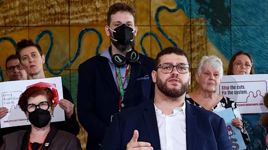 Greens Senator Jordon Steele-John and NDIS advocates during a press conference in Parliament House.