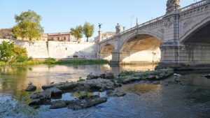 Ancient Roman bridge in the Tiber river exposed due to drought