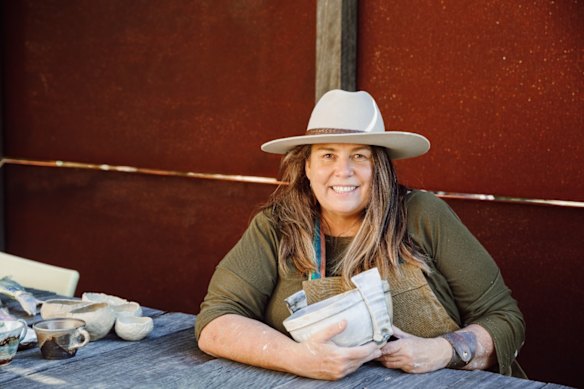 Cath Carroll, artistic director of the Straddie Arts Trail, with one of her ceramic creations.