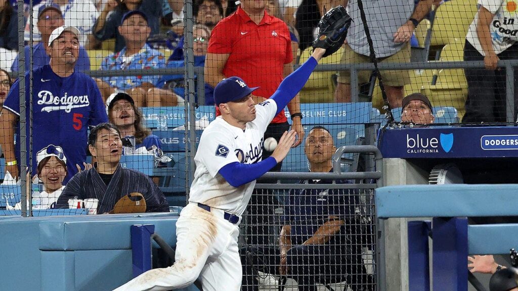 Dodgers star Freddie Freeman takes scary tumble down dugout steps trying to catch pop fly