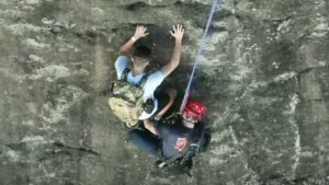 Free climber stranded on Georgia rock face calls 911, prompting dramatic rescue by firefighter