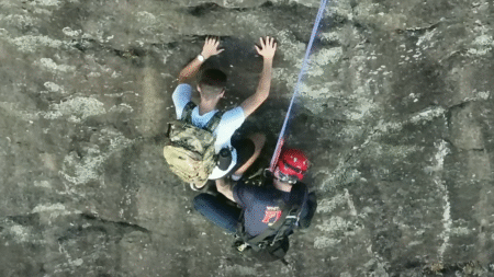 Free climber stranded on Georgia rock face calls 911, prompting dramatic rescue by firefighter