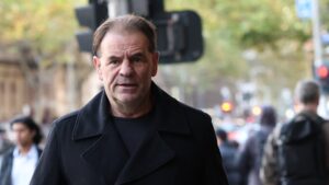Former construction boss arrested and charged over alleged threats to CFMEU officials