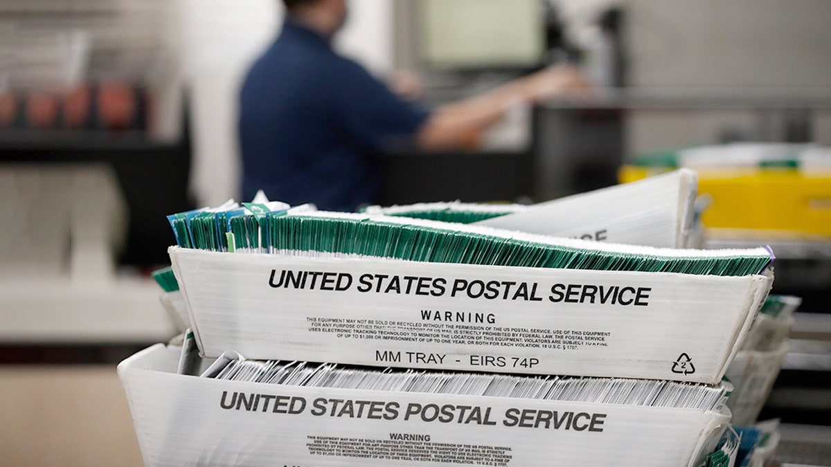 PROVO, UT - OCTOBER 26: Utah County Election workers stack ballots in the election office that were picked up at a United States Postal Service office to be processed on October 26, 2020 in Provo, Utah. Utah is one of several states that has recently moved to mail-in ballots for presidential elections. (Photo by George Frey/Getty Images)