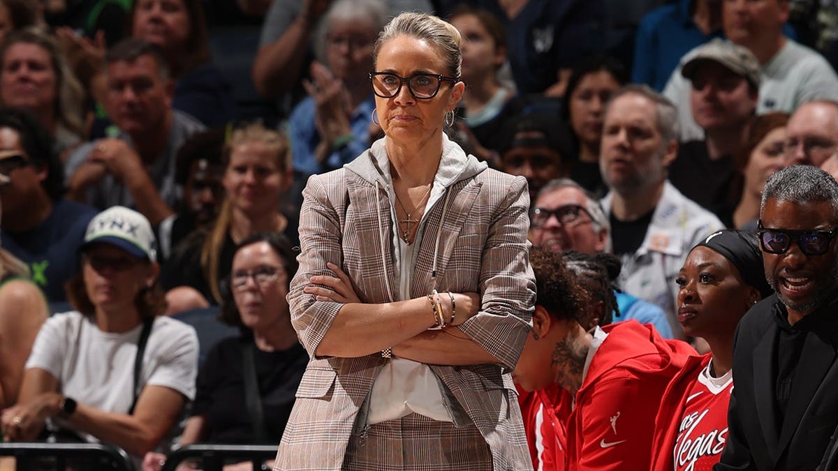 Becky Hammon, head coach of the Las Vegas Aces, looks on during a game.
