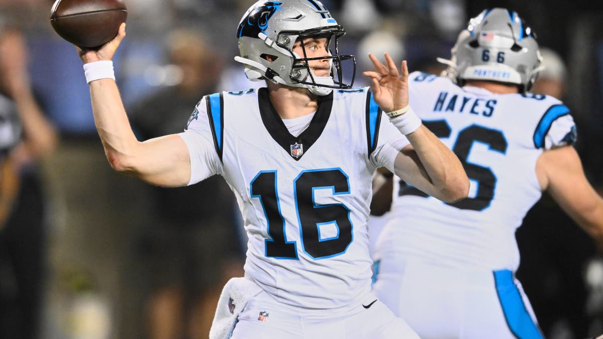 Haynes Kinh passes during an NFL preseason game.