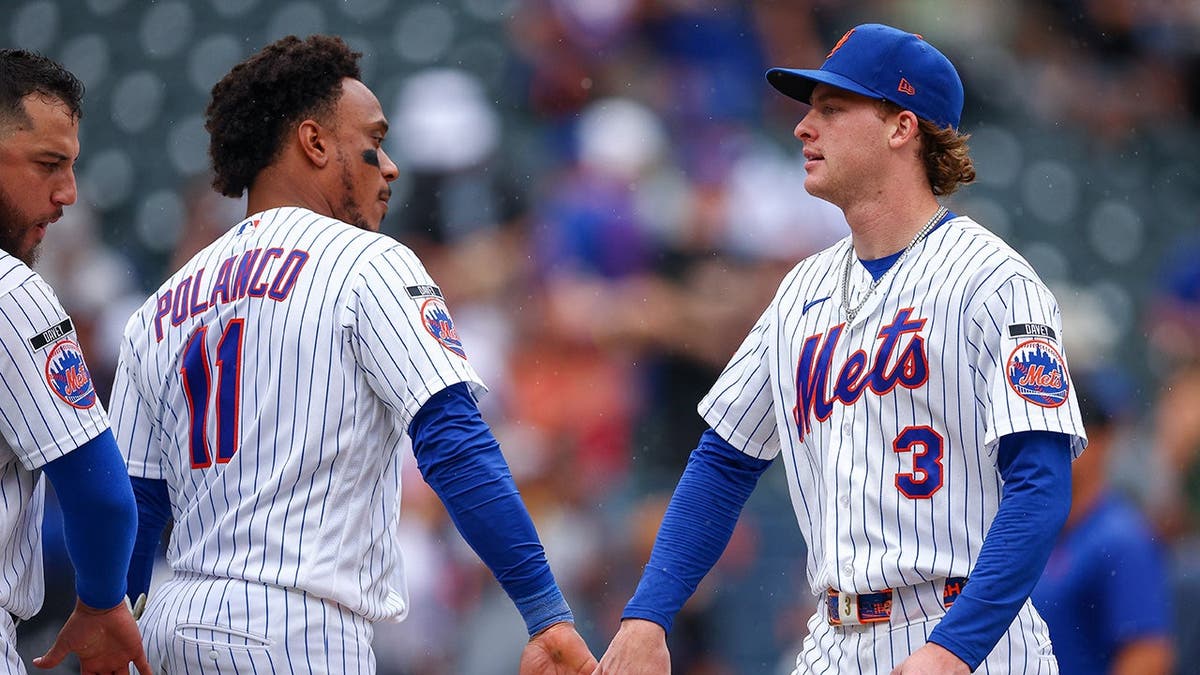 Jorge Polanco and Carson Benge celebrate after the Mets defeat the Nationals at Citi Field.