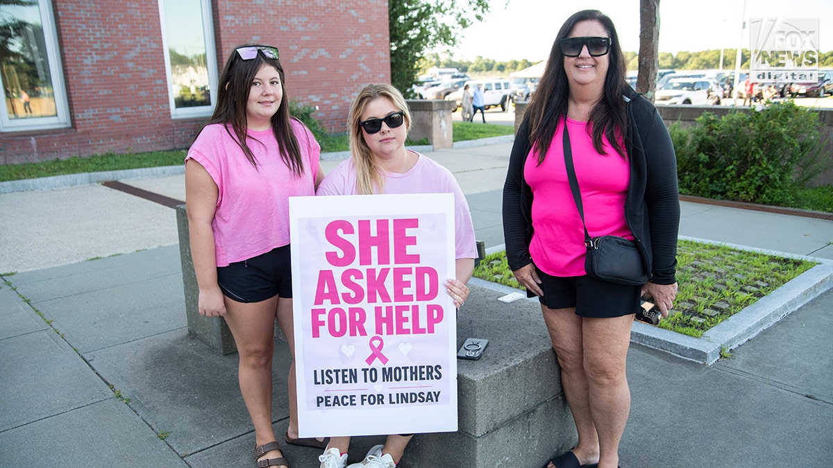 Supporters of Lindsay Clancy's pose for a photo outside of Plymouth Superior Court, Wednesday, August 26, 2026. Clancy is on trial for the murder of her three children in January 2023.