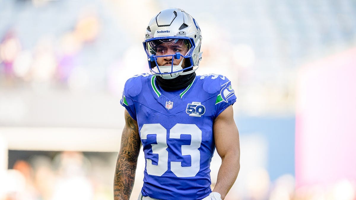 Myles Gaskin, No. 33 of the Seattle Seahawks, looks on before a game.