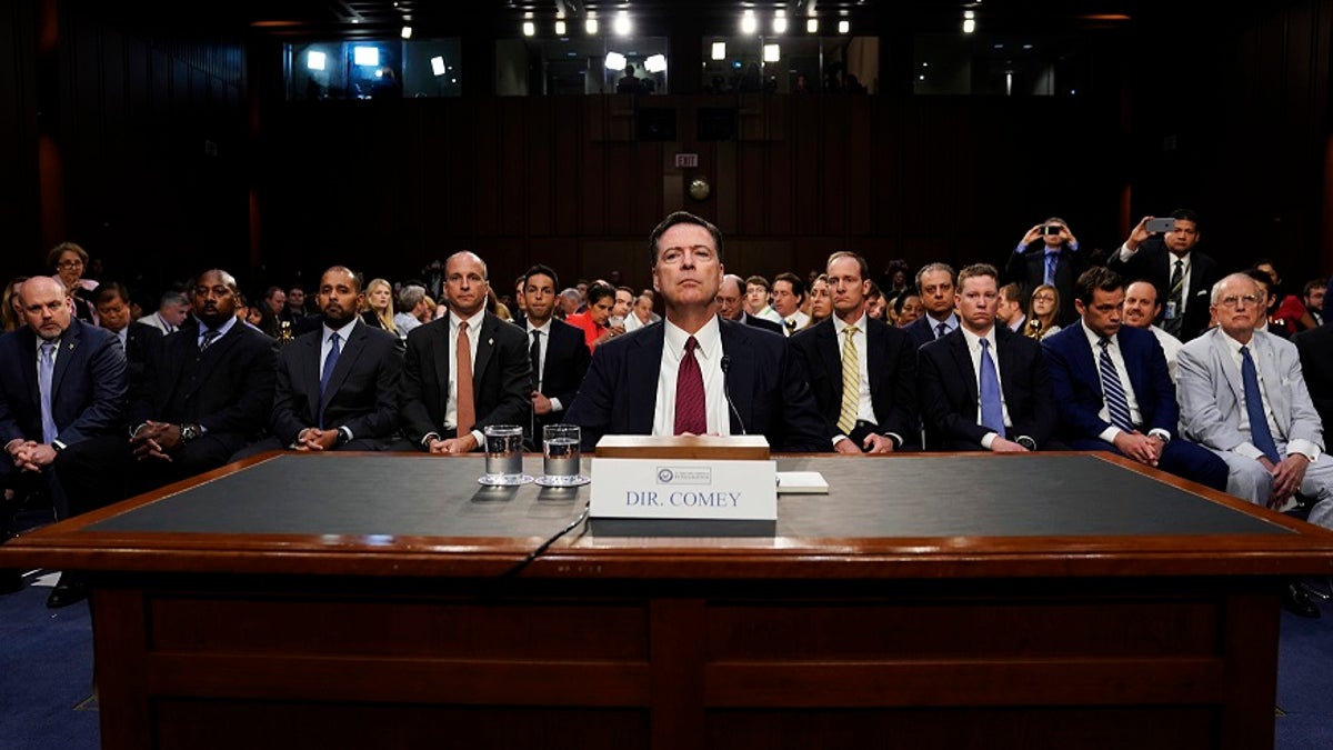Former FBI Director James Comey testifies before a Senate Intelligence Committee hearing on Russia's alleged interference in the 2016 U.S. presidential election on Capitol Hill in Washington, U.S., June 8, 2017. REUTERS/Jonathan Ernst - HP1ED681F68T4