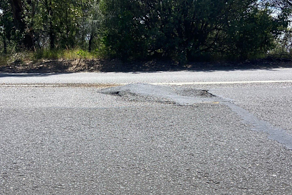 The patched pothole on Arthurs Seat Road that Russel Heggen said acted as a ramp for his motorbike. 