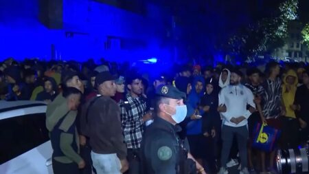 Warning shots fired as migrants move to new facility in Ceuta