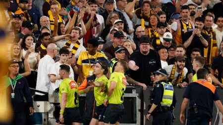 Police investigate fan behaviour and bottle throwing at the MCG