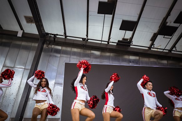 The San Francisco 49ers cheerleaders on stage at Federation Square.