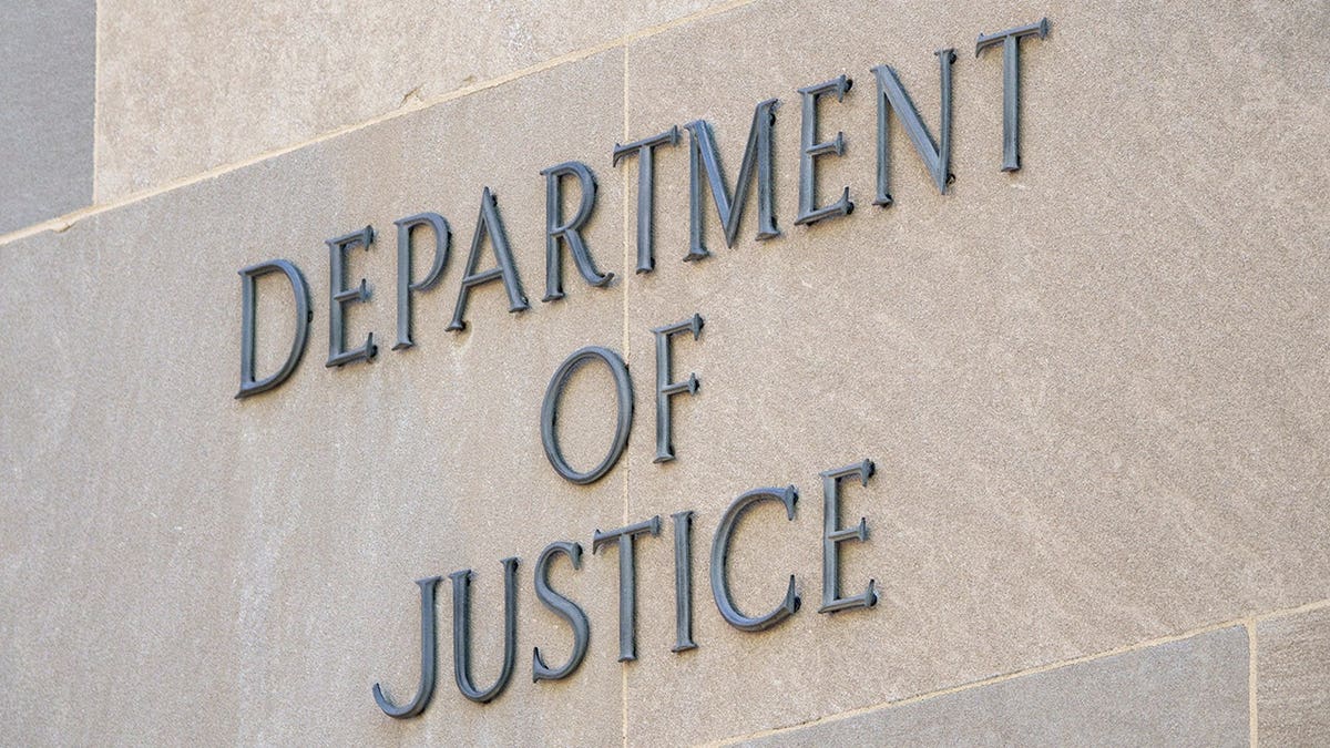 DOJ sign on the edifice of the building.