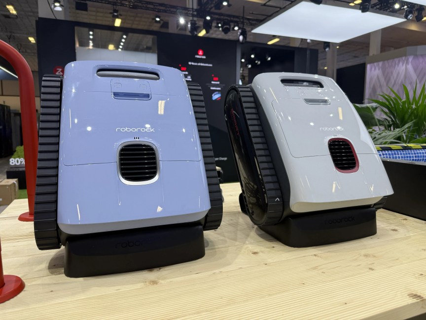 two robot vacuums on show floor