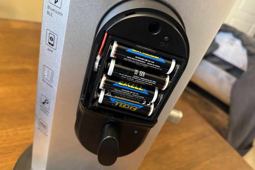 Lyro lock with battery case open on a table.