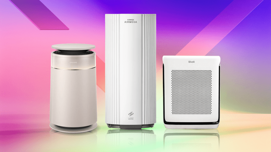 Three air purifiers on a gradient background