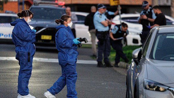 NSW Police at the crime scene in Merrylands West on Thursday. 