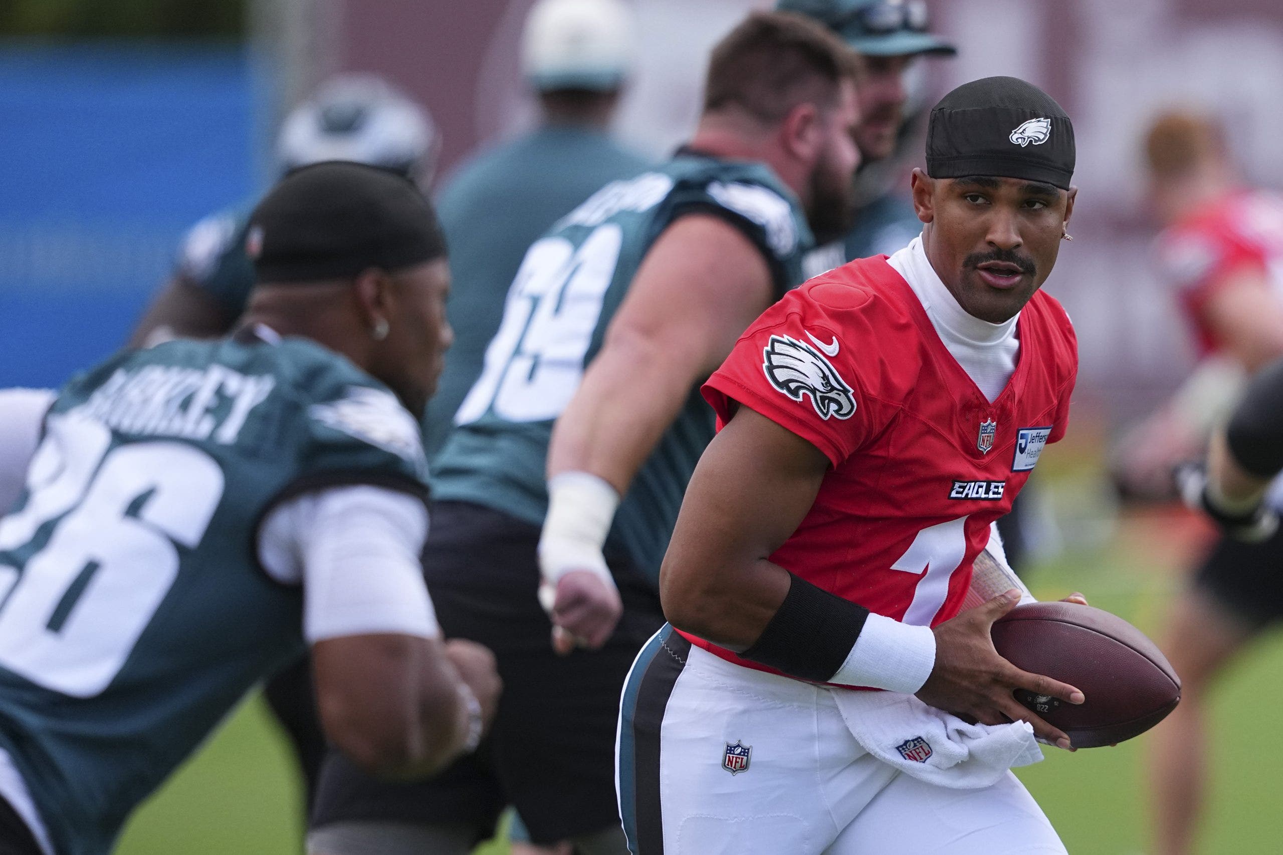 Jalen Hurts faces a potentially big adjustment to new Eagles offensive coordinator Sean Mannion's offense this season. (Mitchell Leff/Getty Images)