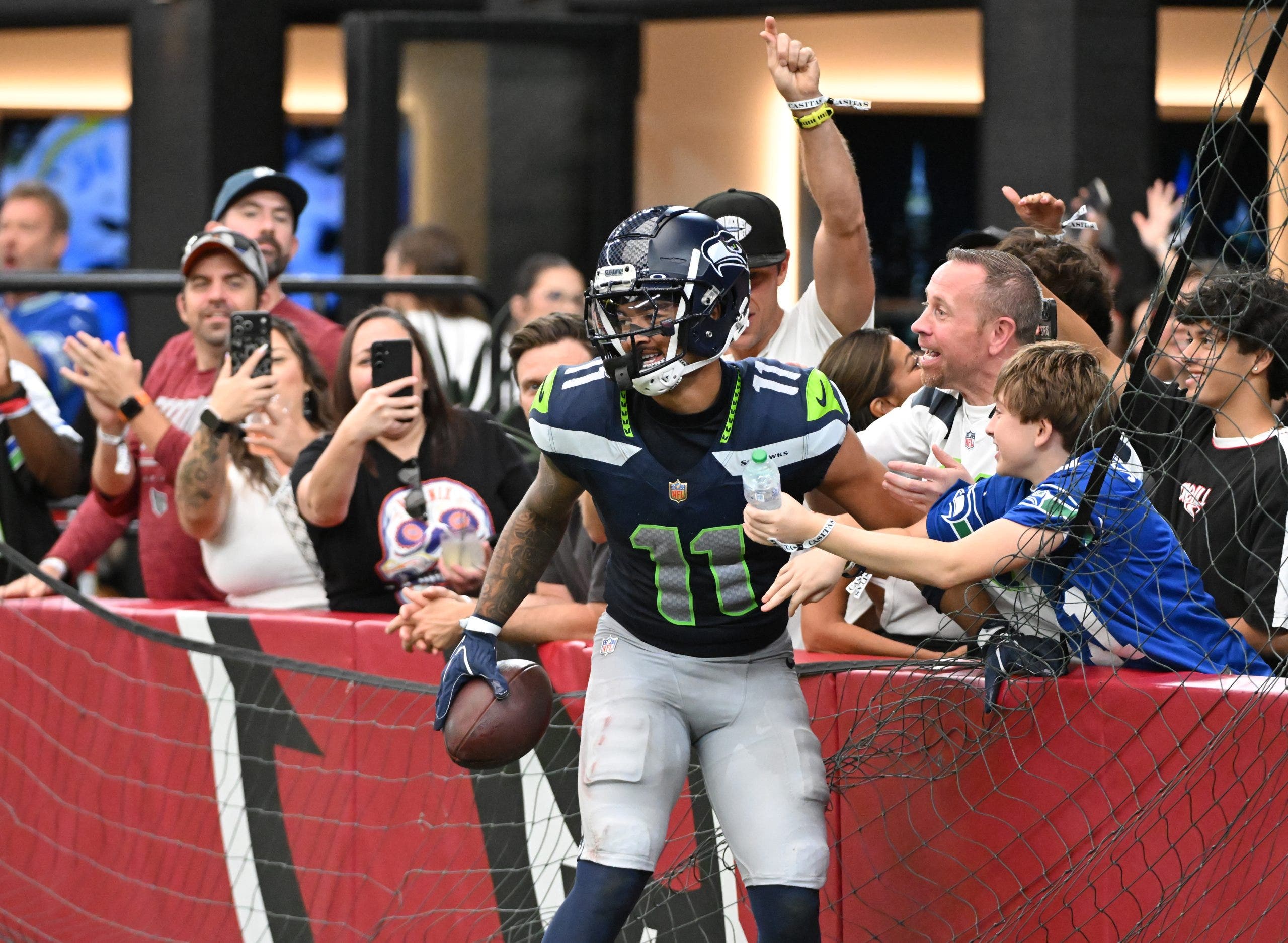 Jaxon Smith-Njigba caught nine passes for 155 yards and a career-high three touchdowns in a 31-7 win over the Arizona Cardinals. (Photo by Norm Hall/Getty Images)