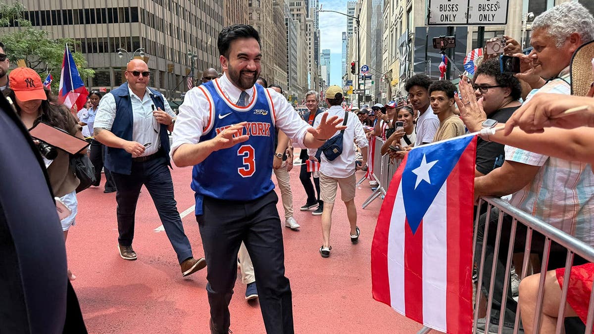 New York City Mayor Zohran Mamdani standing at the Puerto Rican Day Parade on Fifth Avenue in Manhattan