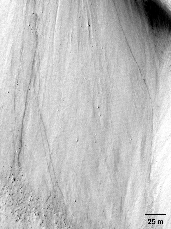 A closeup of Cerberus Fossae on Mars before a quake with boulder line at top right