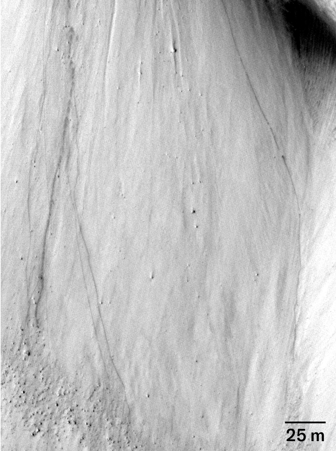 A closeup of Cerberus Fossae on Mars before a quake with boulder line at top right