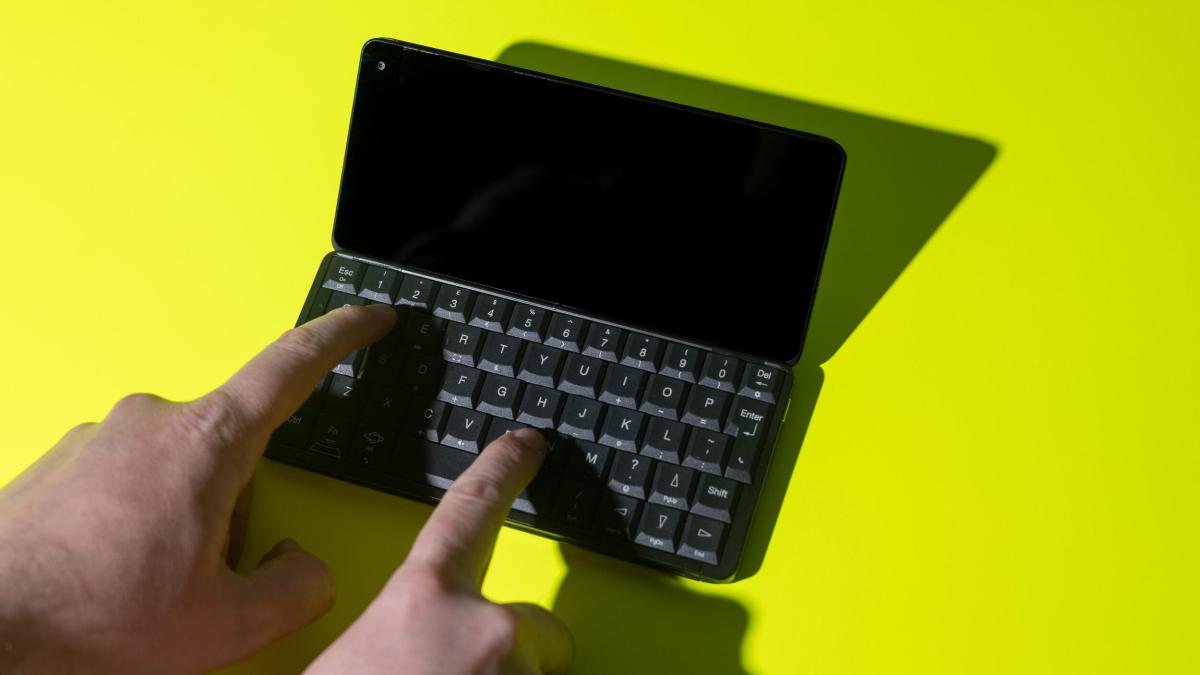 Fingers typing on the Gemini PDA's keyboard