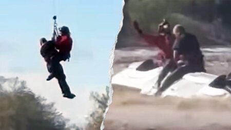 Arizona sheriff's helicopter crew rescues man stranded atop overturned truck in rapidly rising floodwaters