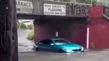 Family rescued from submerged cars as heavy rain hits Victoria