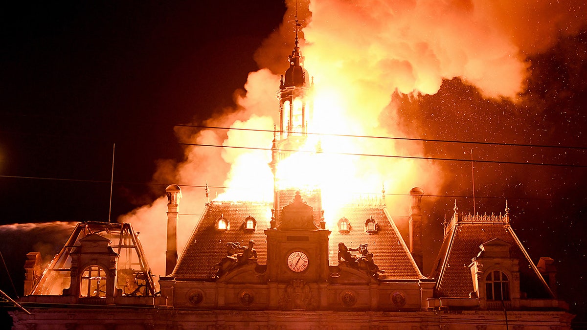 This photograph shows a fire burning and destroying the city hall after a group of individuals forced entry into the building during ongoing protest action against the "high cost of living", in Limoges, central France on October 17, 2026 as part of a nationwide call for mobilisation bringing together various groups expressing their anger: former "Yellow Vest", secondary school and university students, climate activists and even farmers. After weeks of student protests, France faces broader, nationwide demonstrations on October 17, 2026 over the cost of living, setting up a potentially fraught six months heading into a presidential election. A police source told AFP that authorities estimated nearly 200,000 people could take part, with 40,000 in Paris.