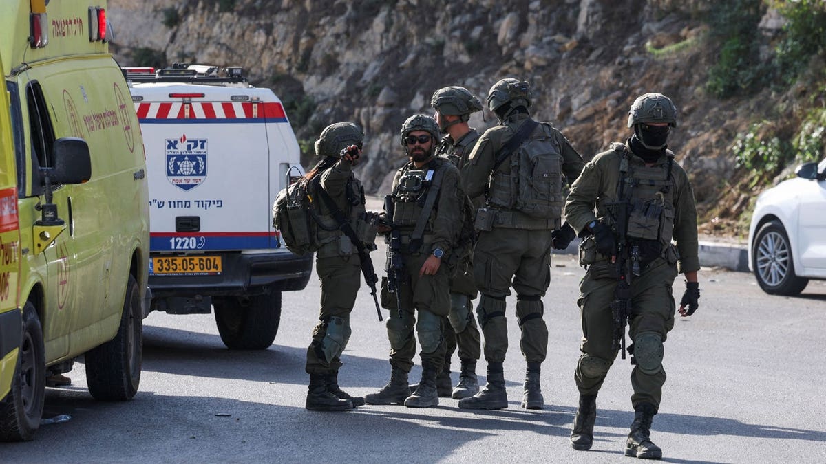 Israeli forces stand guard near a shooting scene in Hebron in the Israeli-occupied West Bank October 23, 2026.
