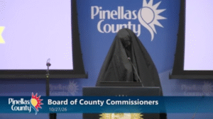 Woman wearing burka escorted out of Florida county meeting after playing call to prayer recording