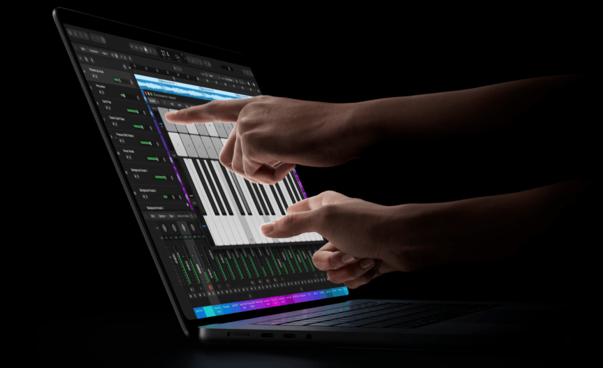 MacBook Pro with touchscreen display being played like a piano