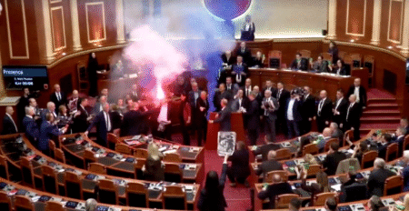 Albanian opposition lawmakers disrupt parliament with smoke flares and furious attacks on socialist PM