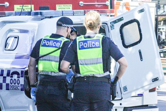 Police take Brendan Nugent into custody on Monday.