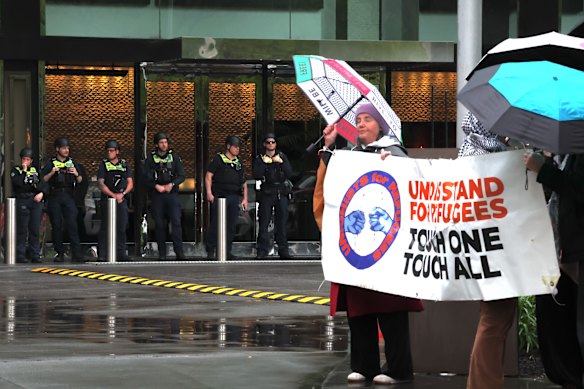 Protesters and police outside Crown during One Nation’s campaign launch on Saturday.