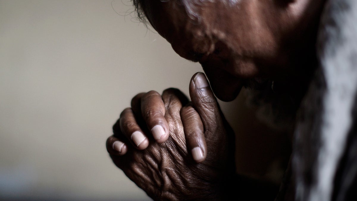 An elderly Pakistani Christian man, prays during a Mass on Good Friday in a church in Islamabad, Pakistan, Friday, March 29, 2013. Christians around the world are marking the Easter holy week. (AP Photo/Muhammed Muheisen)