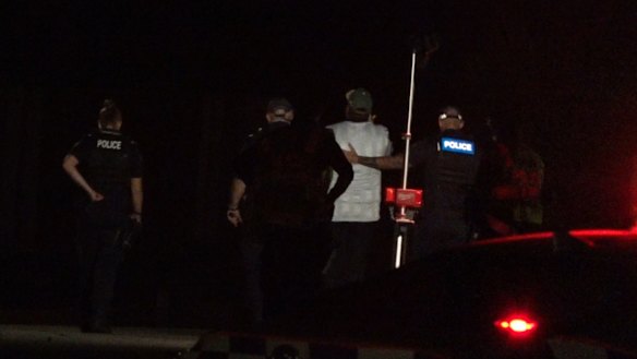 Police at the scene of a single-vehicle crash in Buccan, near Beenleigh, on Wednesday evening.