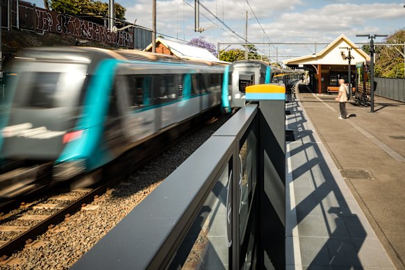 Metro trains pass through Hurlstone Park station on Friday.